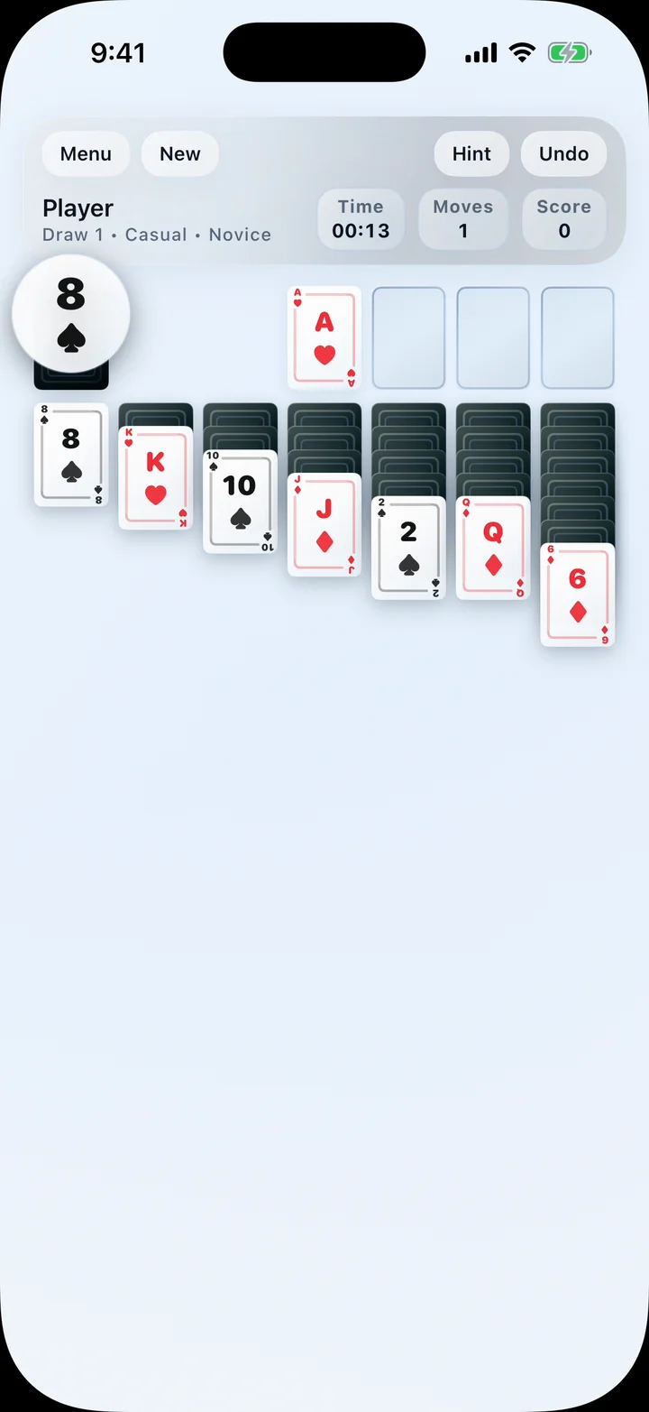 Long-press card magnifier enlarging a card rank and suit on iPhone